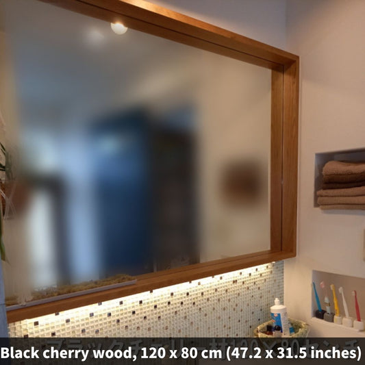 Custom-sized mirrors with a maple frame, known for its elegant wood grain.