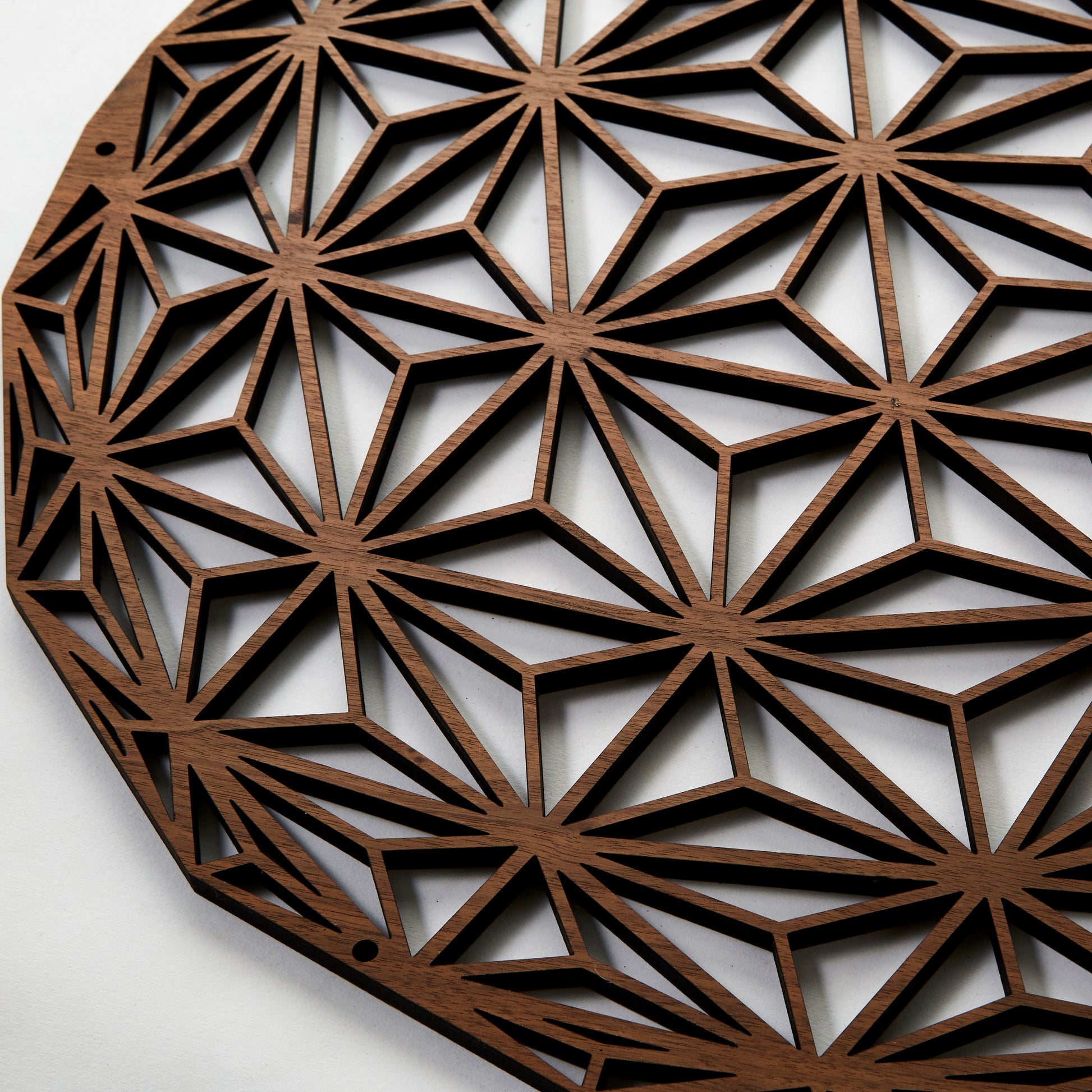 A close-up of the Asanoha wall decor. A series of geometric patterns.