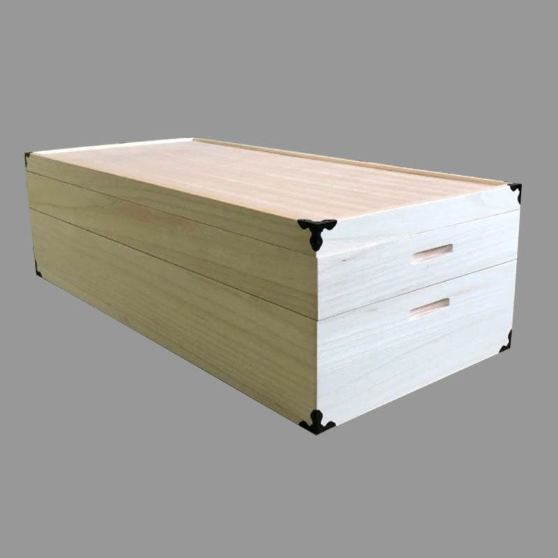 Cut-out image of a two-tier kimono storage made of paulownia wood. The wood has a white and smooth texture.