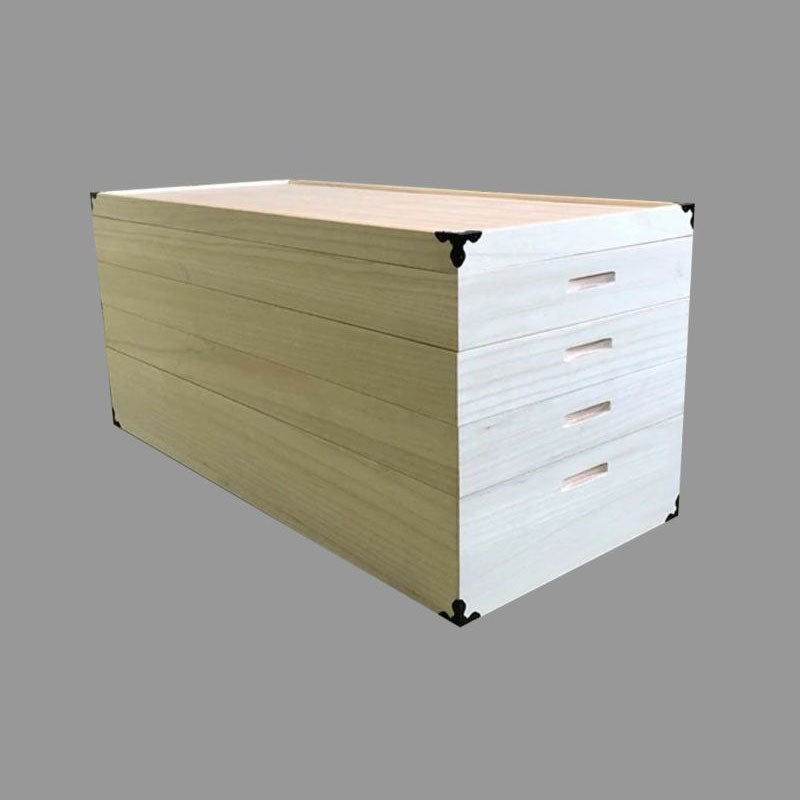 Cut-out image of a four-tier kimono storage made of paulownia wood. The wood has a white and smooth texture.