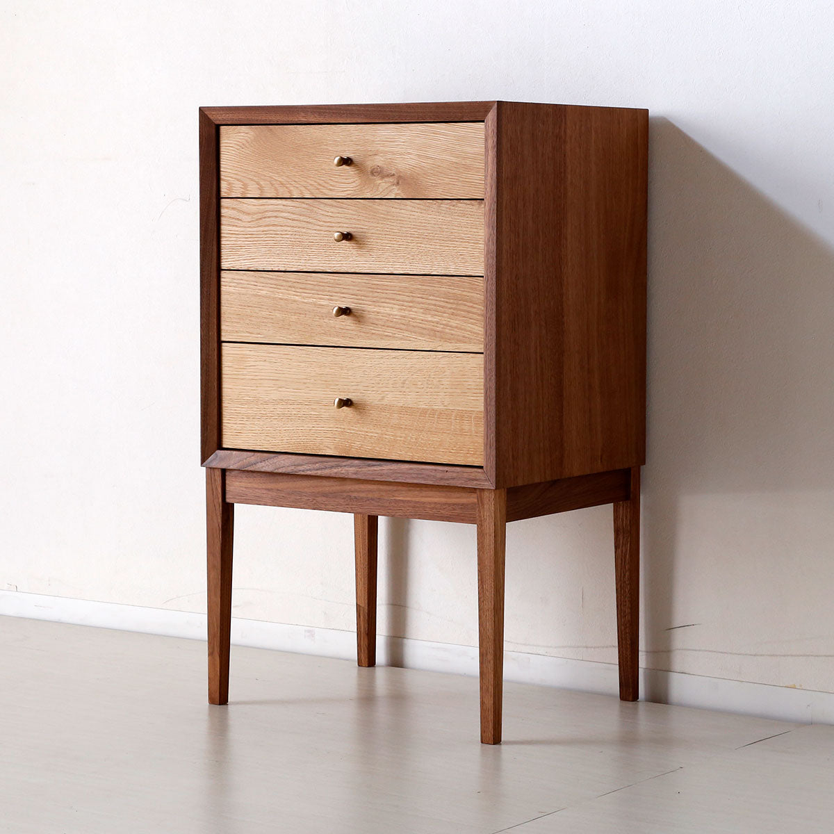 Stylish chest of drawers made of popular woods joined using traditional Japanese techniques.