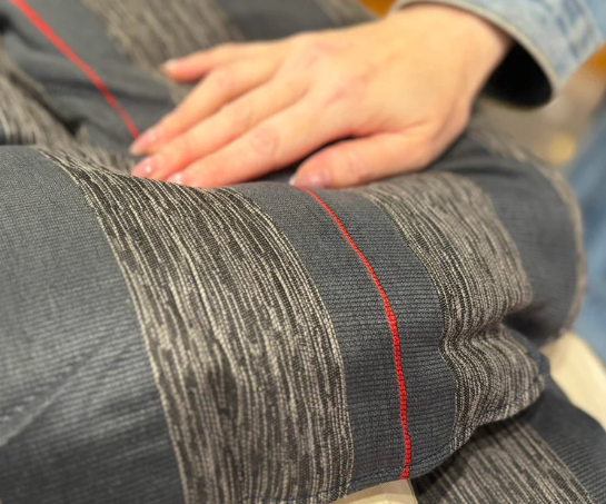 A luxury thick-layered Japanese kotatsu futon with a natural wood tabletop, perfect for keeping heat trapped inside.